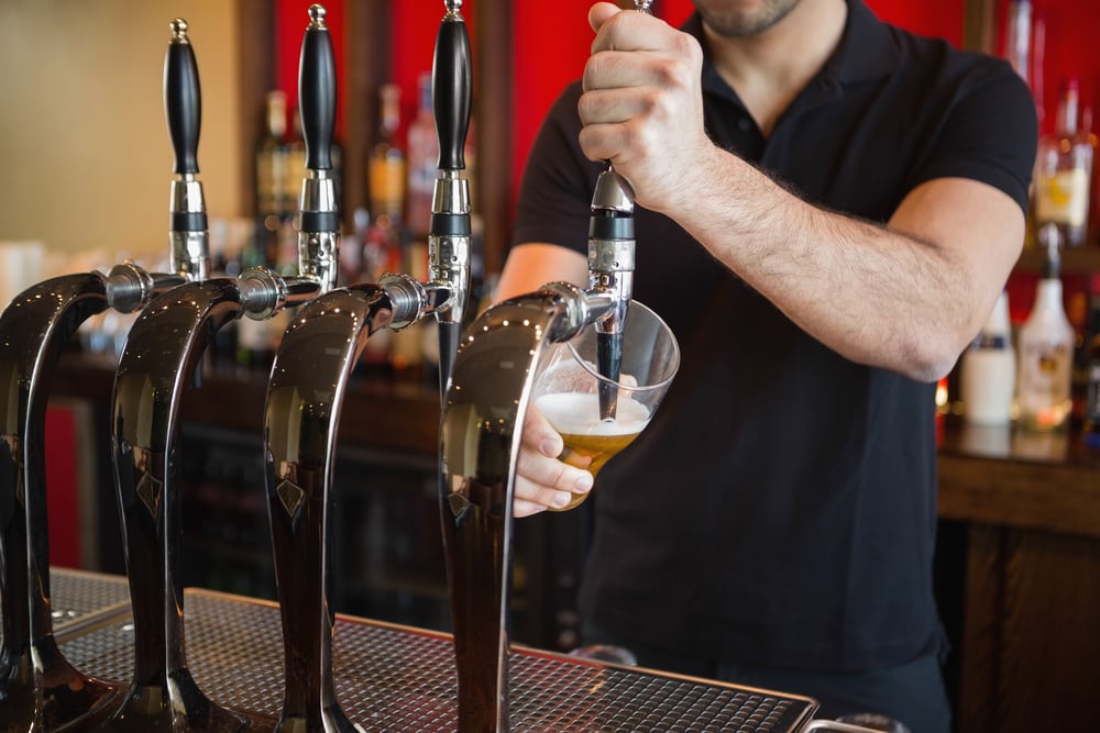 Bartender serving beer