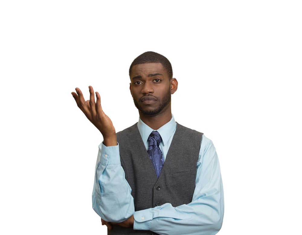 Closeup portrait dumb clueless young executive man, arm out asking why what problem so who cares, I dont know, isolated white color background. Negative human emotion facial expression feelings