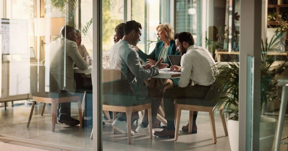 Leaders attending meeting in conference room