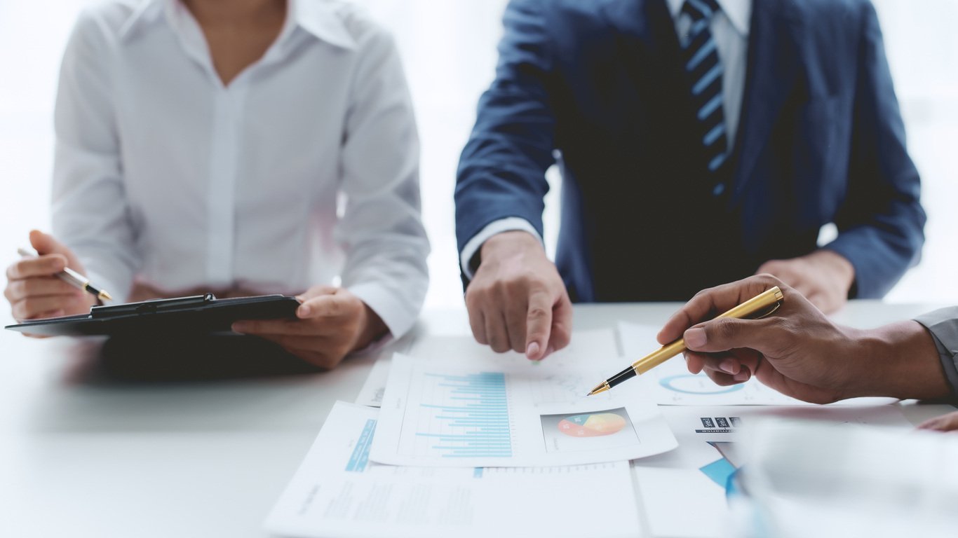 Hiring managers reviewing candidate assessments in the hiring process